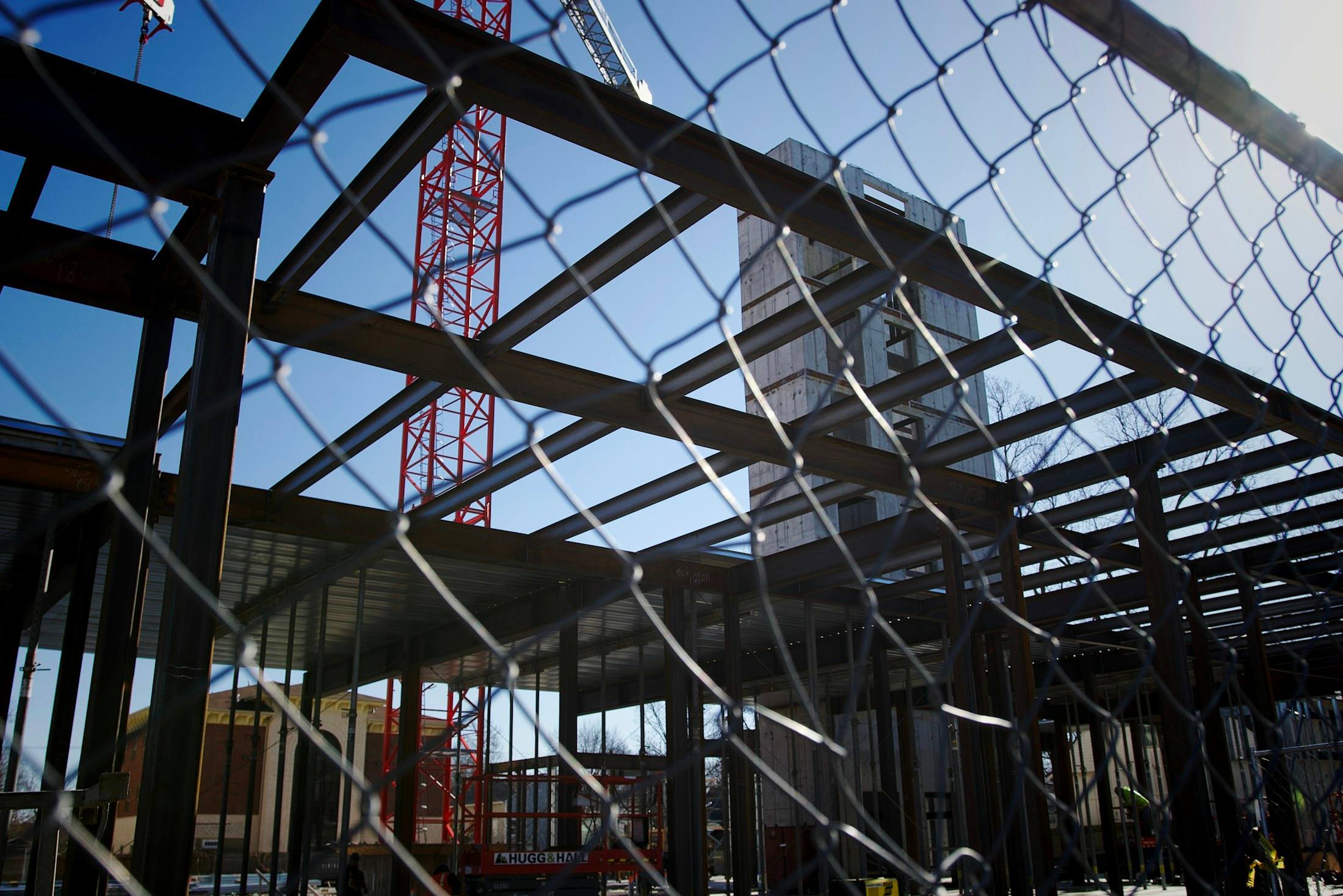 Construction site seen through a chain link fence